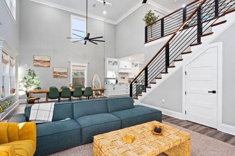 Our open floor plan invites large groups to gather seamlessly, allowing you to cook up a storm in the fully-equipped kitchen without missing a beat in the lively living area. A perfect fusion of functionality and sociability.