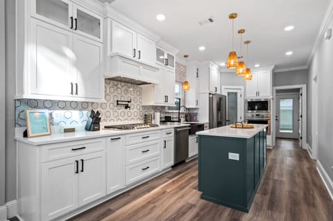 Savor the moment in our bright, modern kitchen – where every culinary adventure is made possible by a fully stocked array of tools and basic ingredients. Your culinary haven awaits.