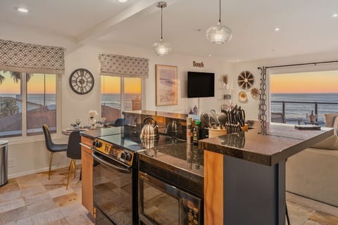 Open plan kitchen and living room overlooking the ocean