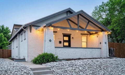 Charming Denver Highlands bungalow with covered porch and string lights