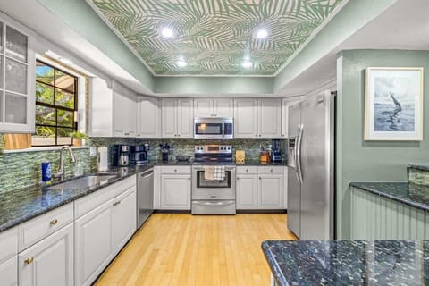 Awakening the senses with a caffeine-lover's dream - the kitchen brims with a fully stocked lineup, featuring a Keurig, Drip, and Pour-over coffee makers