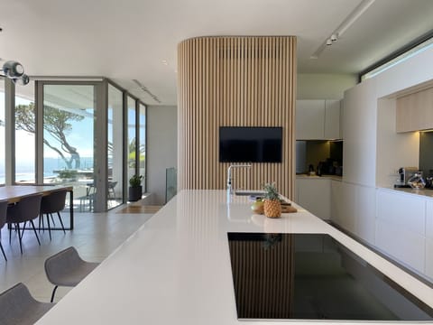 Kitchen island with view of hidden prep area