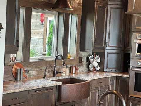 The kitchen is stocked with all the necessities one might need for cooking and entertaining.