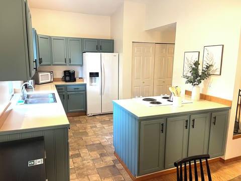 Open concept kitchen allows you to visit with others while you cook.