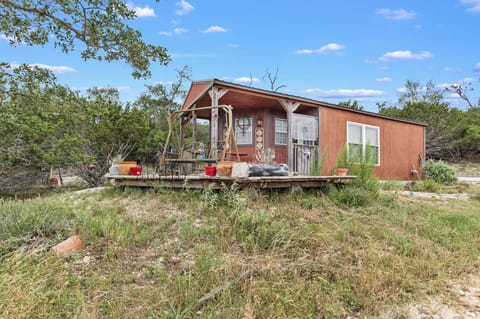 The rustic wooden construction of the lighthouse stands out in proud contrast against its natural surroundings.