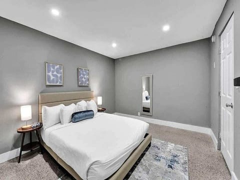 Bright queen bedroom with modern decor