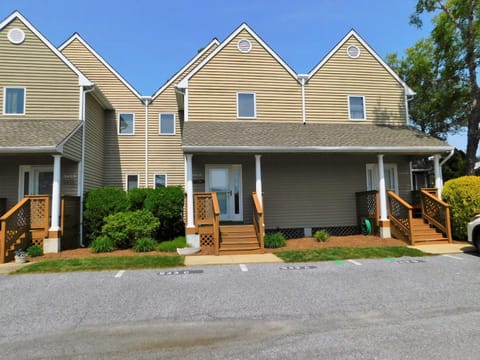 543C hudspn Ave, Stewards Watch, Bethany Beach - That photo confirms the property at 543C Hudson Avenue in the Stewards Watch community. Those distinct triple-gabled townhomes are a signature look for that specific development in Bethany Beach.  The unit is elevated with a covered front porch and includes dedicated off-street parking for two vehicles directly in front.