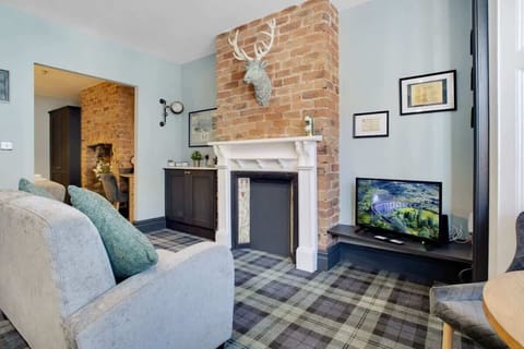 Spacious living room equipped with a SMART TV with Netflix, an indoor fireplace with ample seating to sit down & relax. 