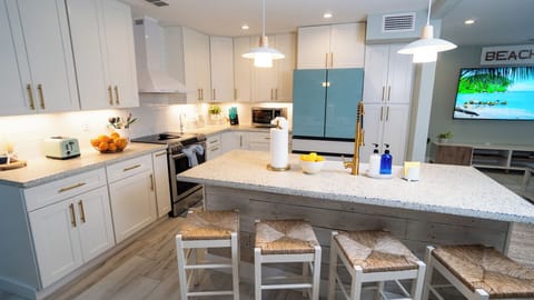 Kitchen with luxury amenities and ample counter space