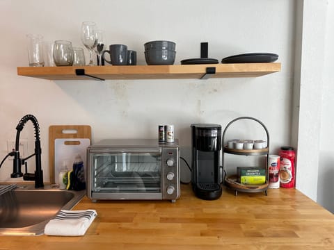 A sleek, contemporary kitchen that makes cooking a breeze with ample space and high-end finishes.