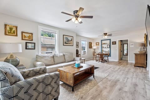 Gather with family or friends in this open-concept space that flows from living room to dining area with ease.