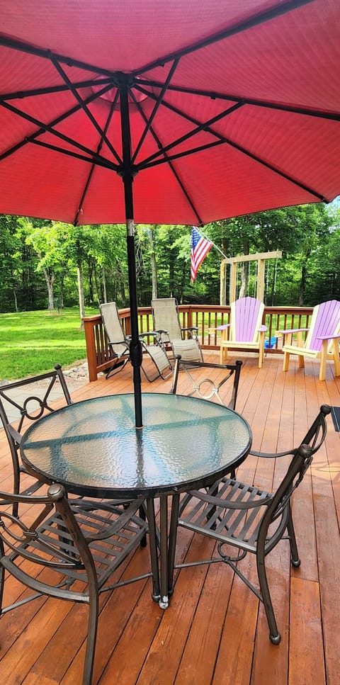 Outdoor patio table and additional lounge chairs.