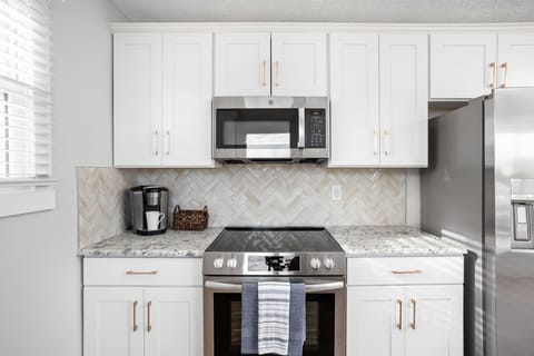 Brand new stainless steel appliances await your use.