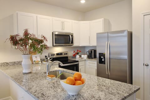 Full kitchen is equipped with quality cookware and baking necessities.