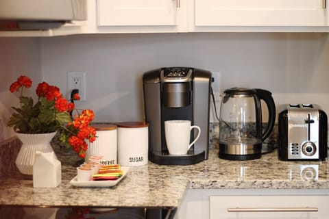 A coffee machine, an electric kettle and a toaster are provided.