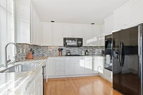 Cook like a pro in our fully equipped kitchen: full-size refrigerator, oven, microwave, toaster, gourmet knife set, cutting board, spoons, and spatulas—all you need for delicious meals!