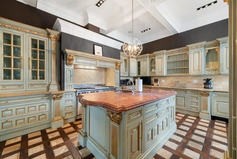 Bright, clean kitchen designed for everyday cooking, w/ plenty of prep space and a functional layout.