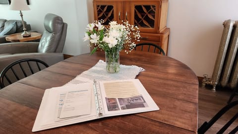 dining area, house guidelines on the table