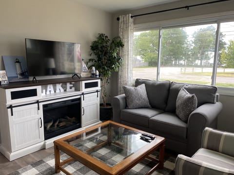 Turn on the fireplace and built in bluetooth speaker and enjoy the lake view!