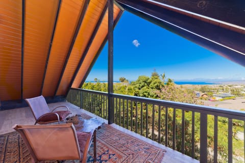 Epic views galore from the primary bedroom lanai. Please note: this area now has beautiful, comfy chairs. You can see Maui in the background! Amazing views from Primary Bedroom Lanai (balcony).