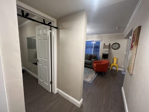 Hallway looking into living room & gym entrances