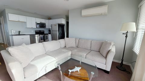 Living room with kitchen beyond