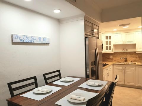 Kitchen and dining area of 1 bed/ 1.5 bath unit