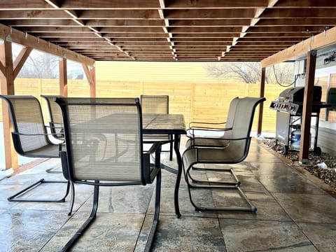 Backyard Patio. Great area for meals while the kids use the playground. 