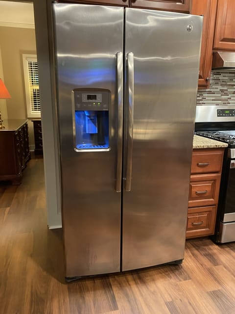 Refrigerator with ice maker and water in the door.