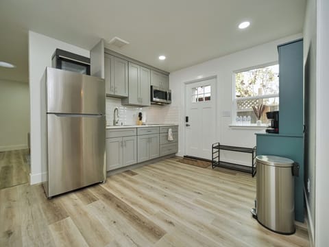 Fully stocked kitchen with all brand new appliances which includes 4 burner stove, microwave, oven.
