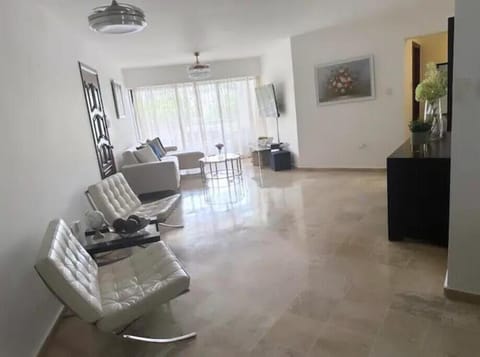 Open and airy living room that opens up to balcony