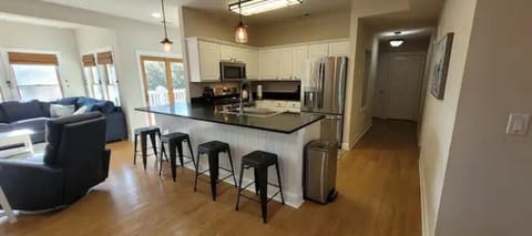 Kitchen, snack bar and hall way to bedrooms