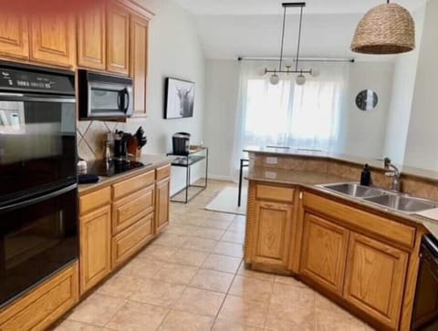 LARGE KITCHEN STOCKED WITH ALL DISHES, GLASWARE, COOKWARE and KURIG