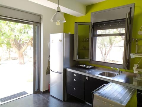 A balcony door leads from kitchen to the yard dinning table
