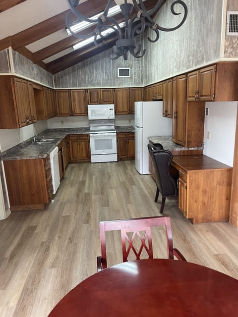 Kitchen features brand new fridge and range.