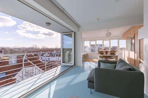 Private balcony overlooking rooftops, perfect for sunset moments 💙🌇