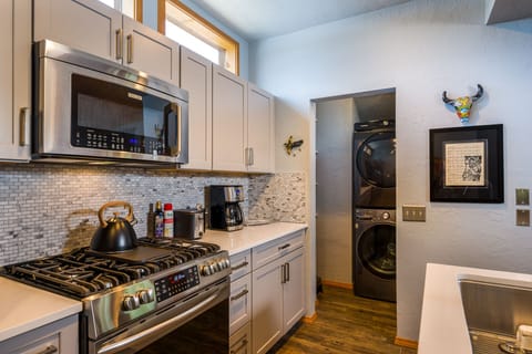 Kitchen w/ Washer & Dryer