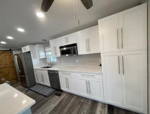 Kitchen with reverse osmosis water filter tank and separate faucet 