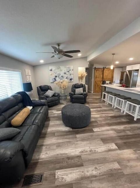 Living room area with four recliners