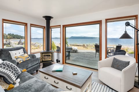 Living room surrounded by ocean and mountain views