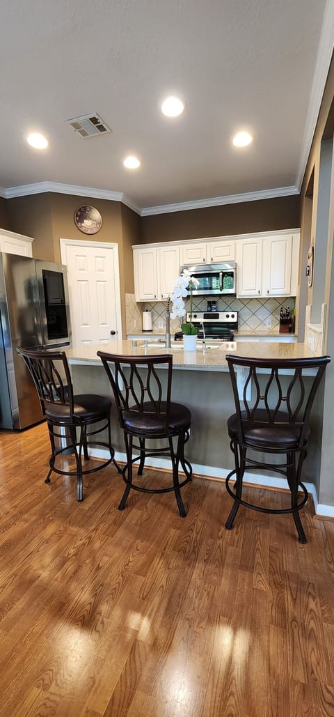 Kitchen island with 3 places to sit in addition to table