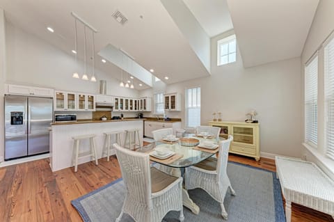 Step into your spacious gourmet kitchen where soaring ceilings and gleaming appliances invite culinary adventures, while natural light streams through elegant windows.