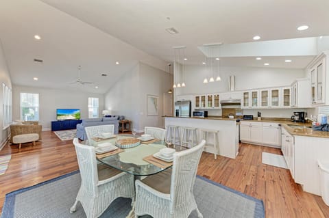Relax in this bright open-plan space where your kitchen flows seamlessly into comfortable living and dining areas, perfect for gathering together.