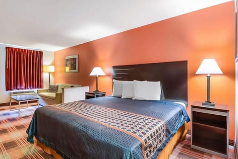 Relax instantly in a bright king room with plush pillows.