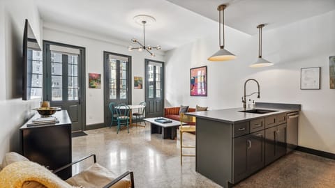 Grab a drink. NOLA art, city views, simple comfort.