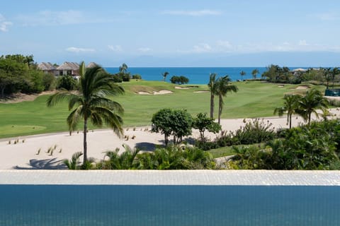 View over private infinity pool down Bahia Golf Course to Bay of Banderas
