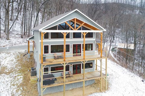 Snowy shot of the back of the cabin!