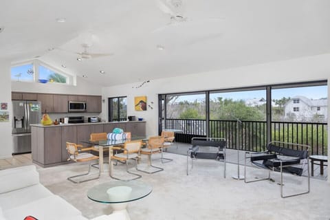 Living room with flat screen TV, overlooking lake