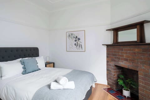 Tranquil and stylish Queen Bedroom 2, designed for comfort and relaxation with soft linens and a serene atmosphere.