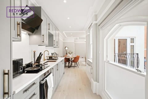 SLEEK AND MODERN KITCHEN AND DINING AREA